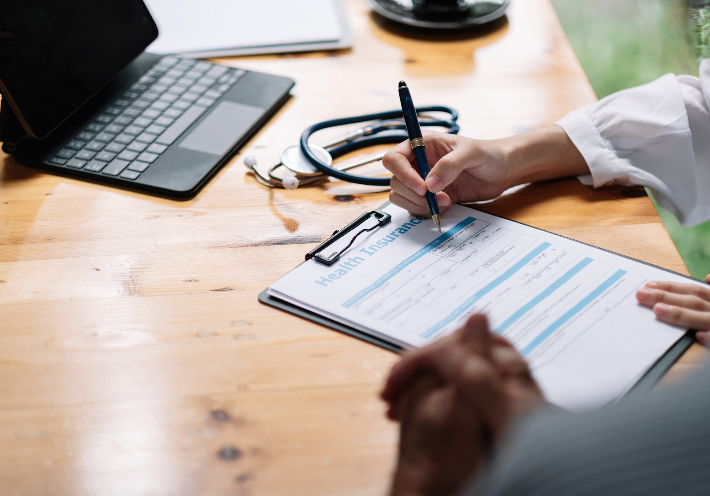 Female health insurance broker presenting his insurance benefits to businessman fill out insurance policy. To prevent future incidents